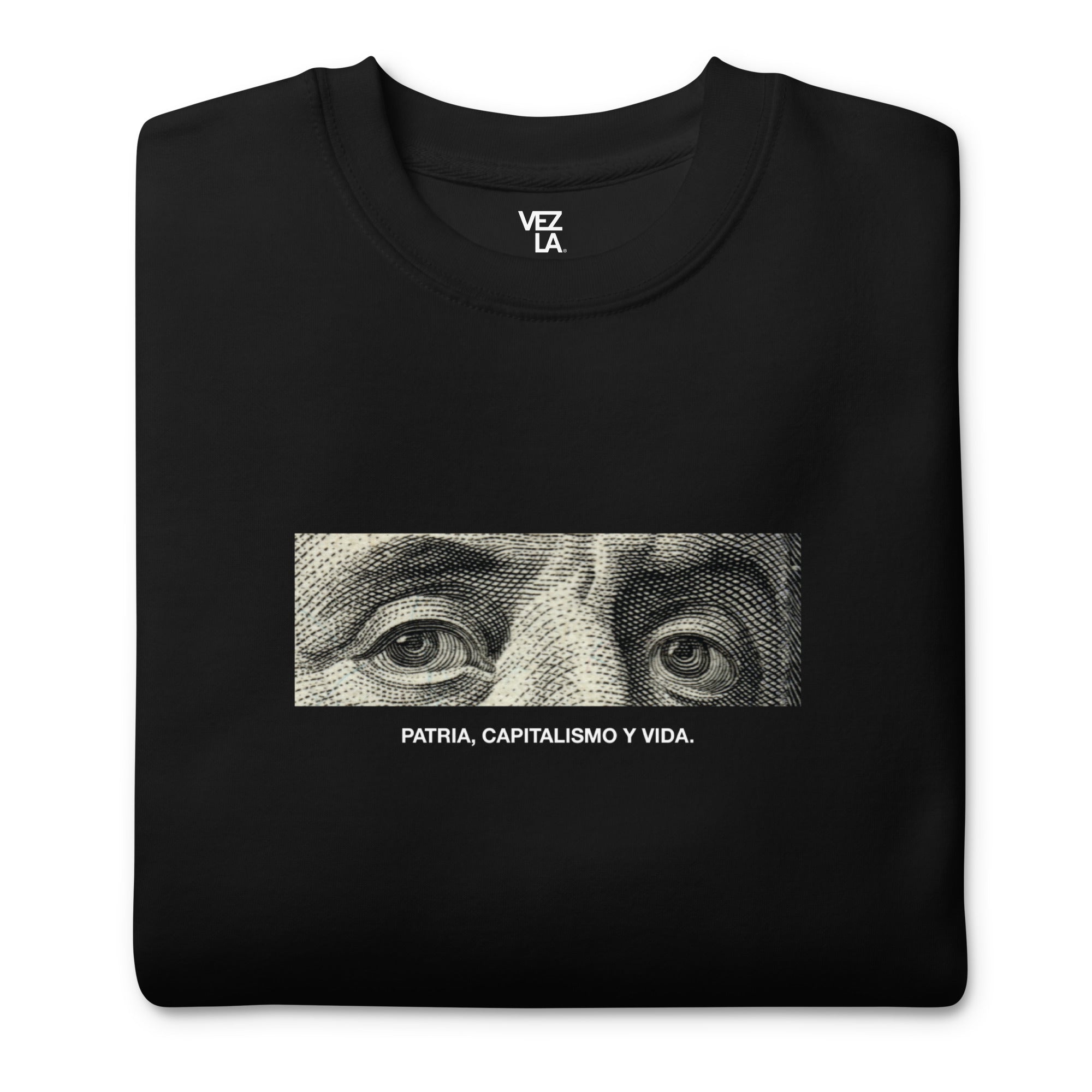 “Patria, Capitalismo y Vida” premium sweatshirt in black, folded detail — Venezuelan political humor #color_black