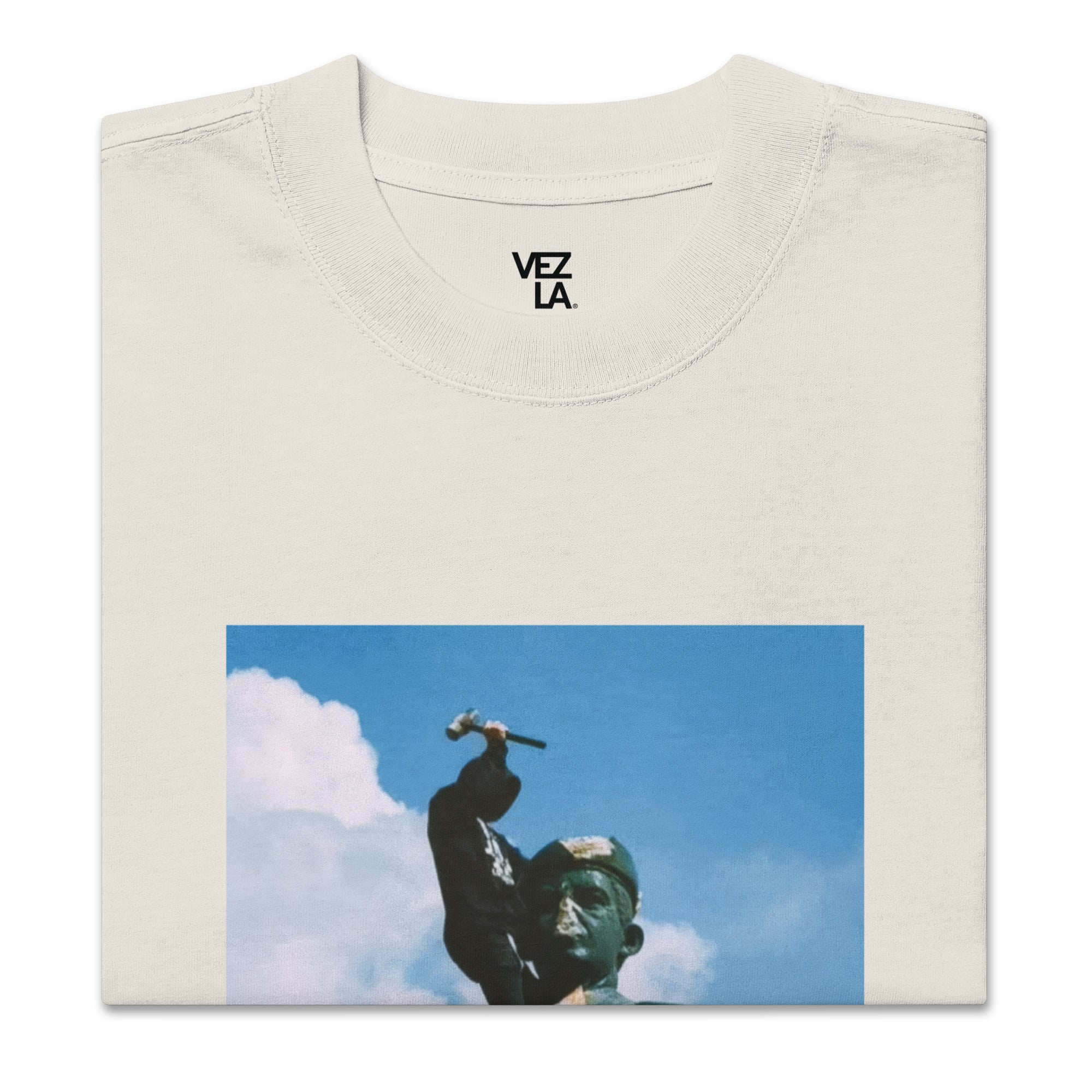 “F*ck Dictators” Chávez statue oversized faded tee in faded bone, folded detail — Venezuelan political humor #color_faded_bone