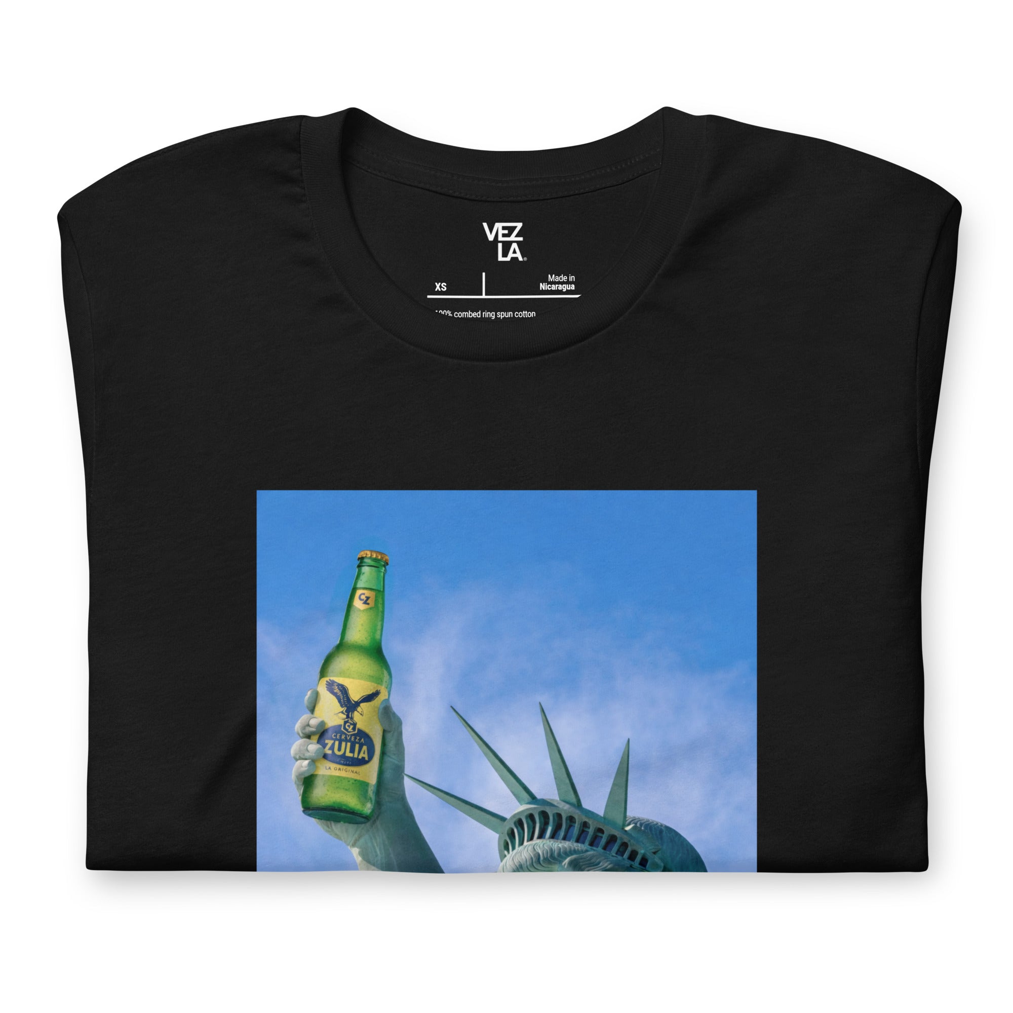 Statue of Liberty holding Zulia beer t-shirt in black, folded detail — Venezuelan American #color_black