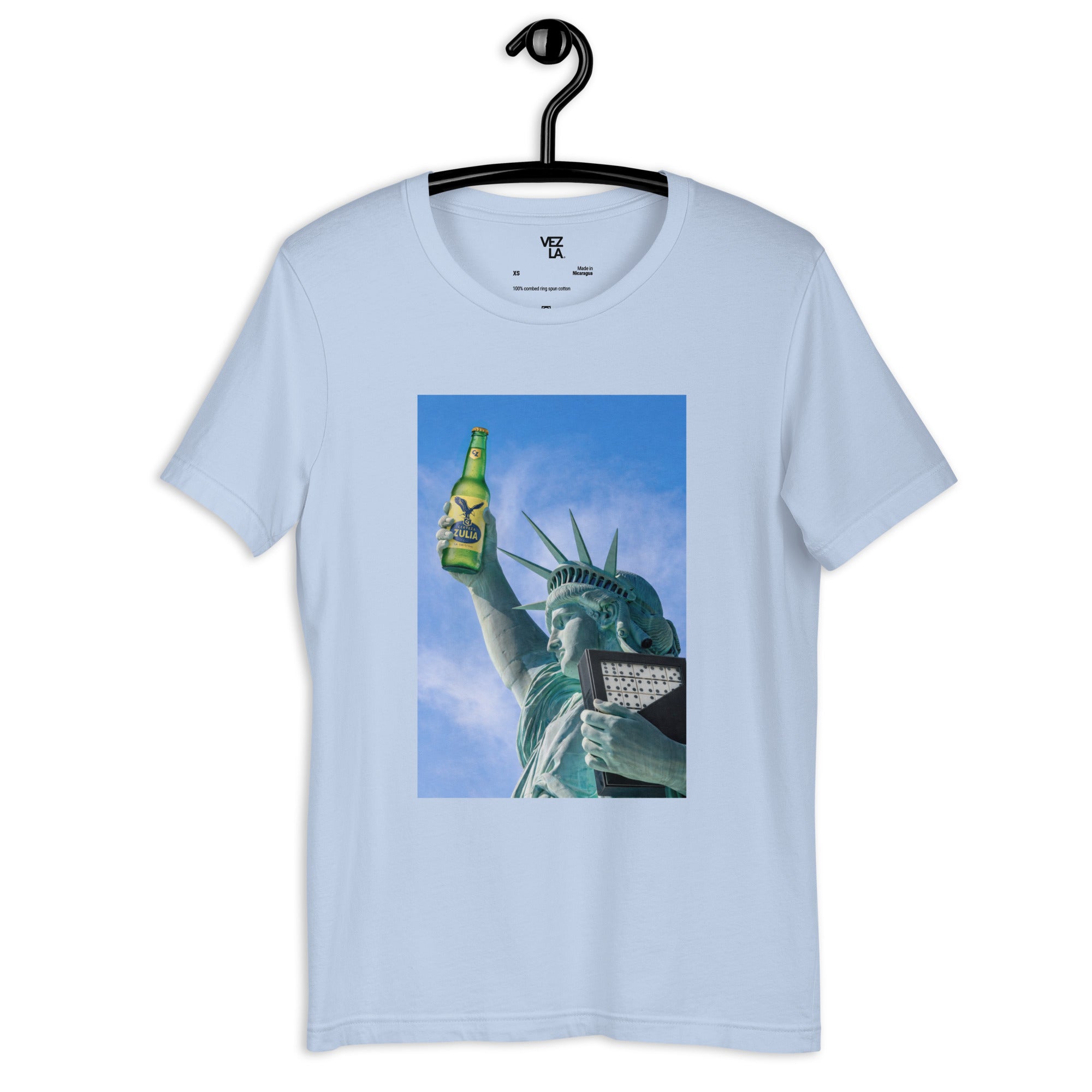 Statue of Liberty holding Zulia beer t-shirt in baby blue, front view — Venezuelan American #color_baby_blue