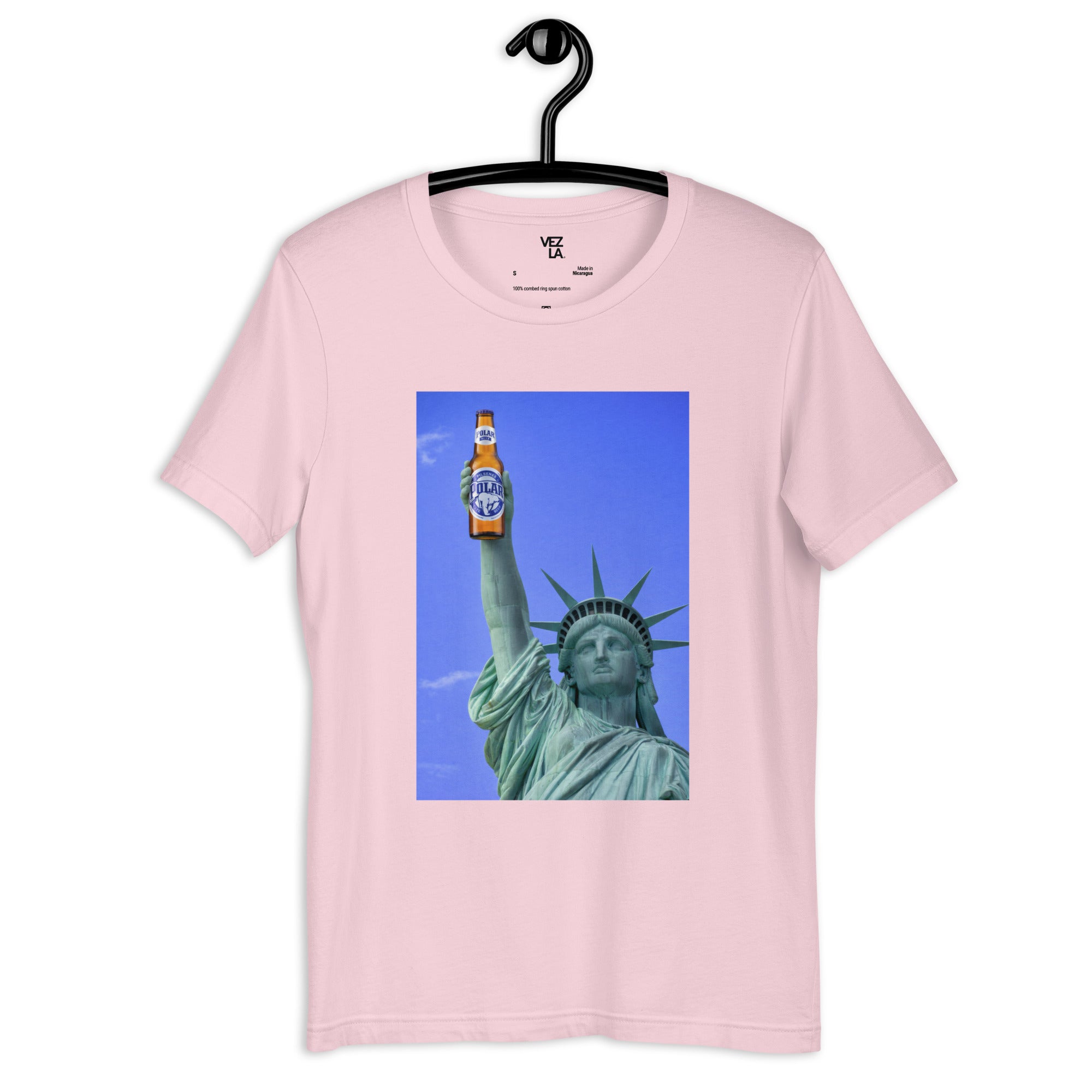 Statue of Liberty holding Polar beer t-shirt in soft pink, front view — Venezuelan American #color_soft_pink