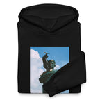 “F*ck Dictators” Chávez statue oversized hoodie in black, folded detail — Venezuelan political humor #color_black