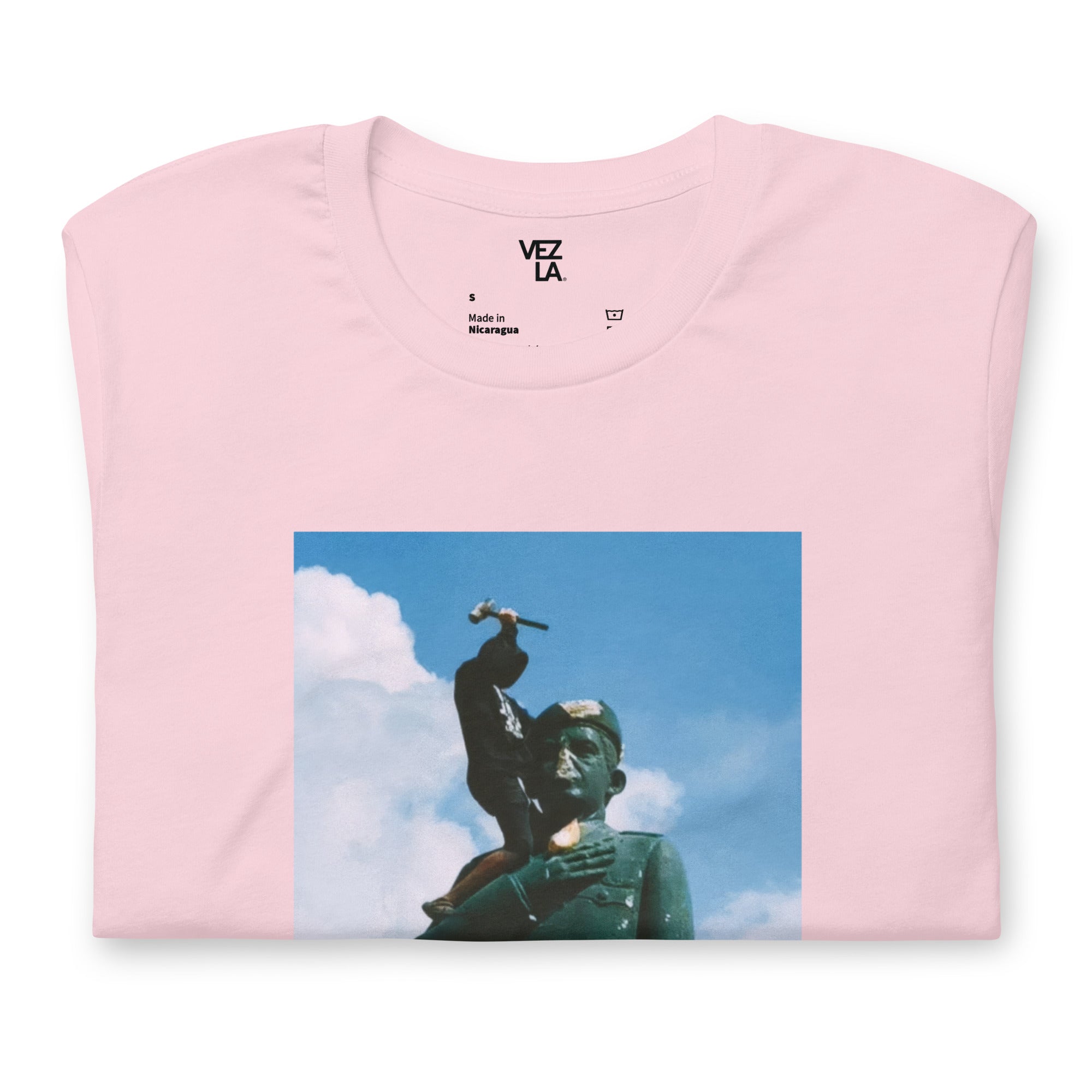 “F*ck Dictators” Chávez statue t-shirt in soft pink, folded detail — Venezuelan political humor #color_soft_pink